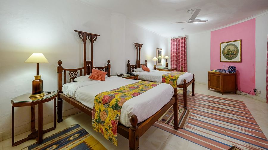 Hill Fort-Kesroli 14th Century Alwar - View of the Rawal Mahal room with twin beds and a lamp on either side